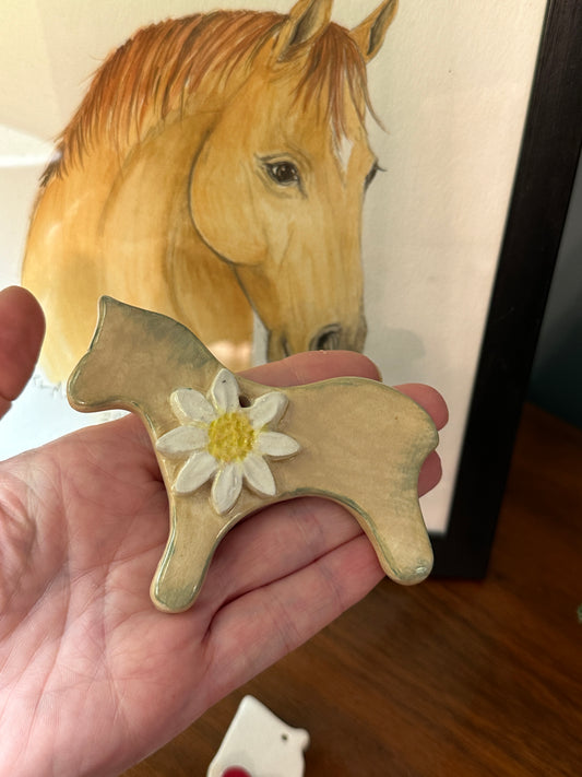 a clay sculpture and a watercolor painting of Horse