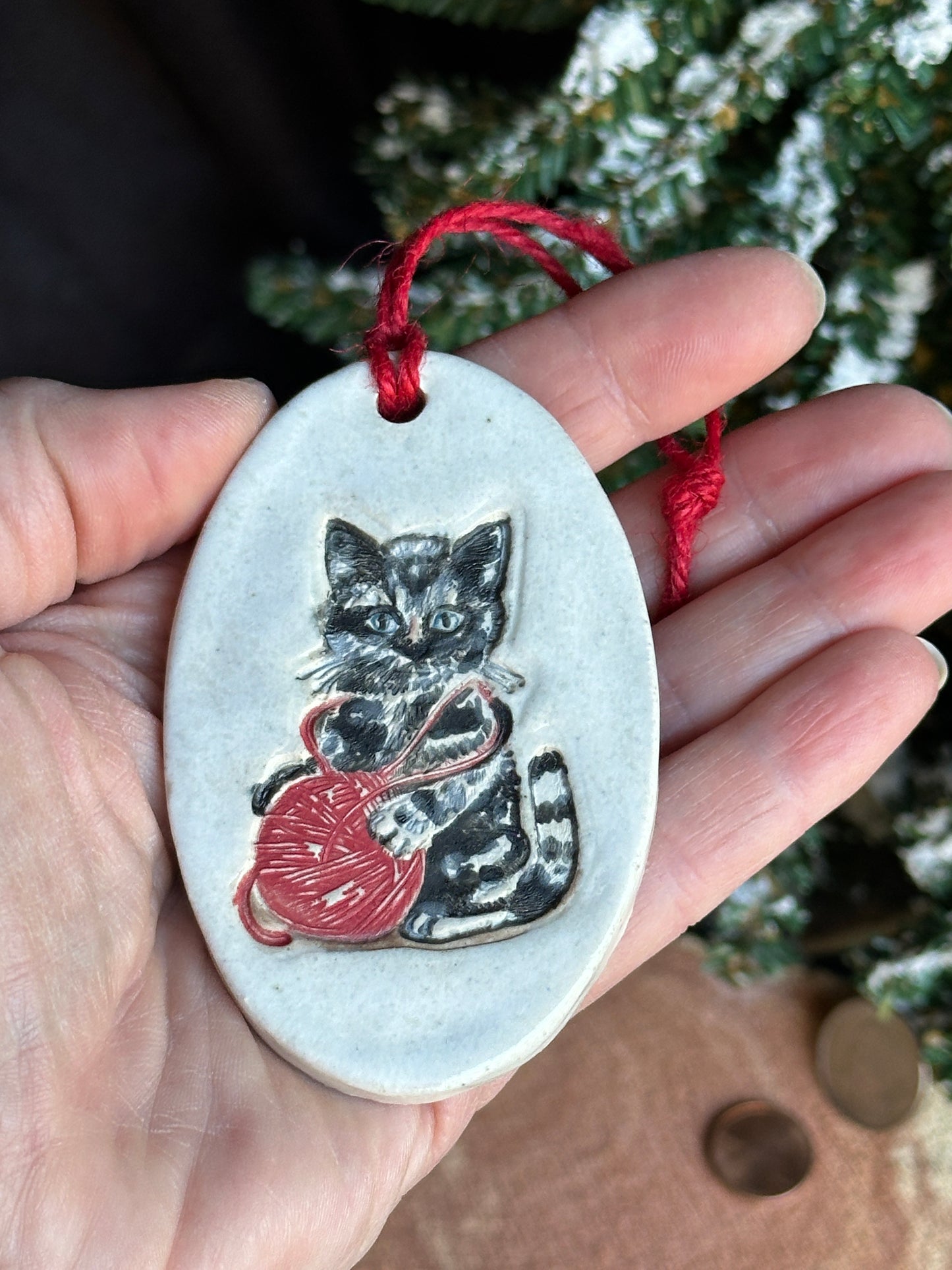 Cat with red yarn Christmas ornament